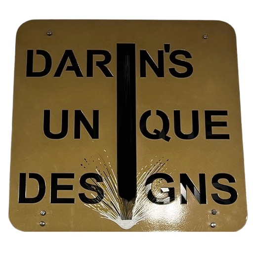 Custom metal sign displaying Darin's Unique Designs logo with a welding-inspired graphic.